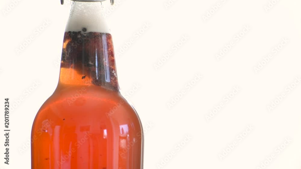 Fresh bottle of berry kombucha Fresh bottle of berry kombucha