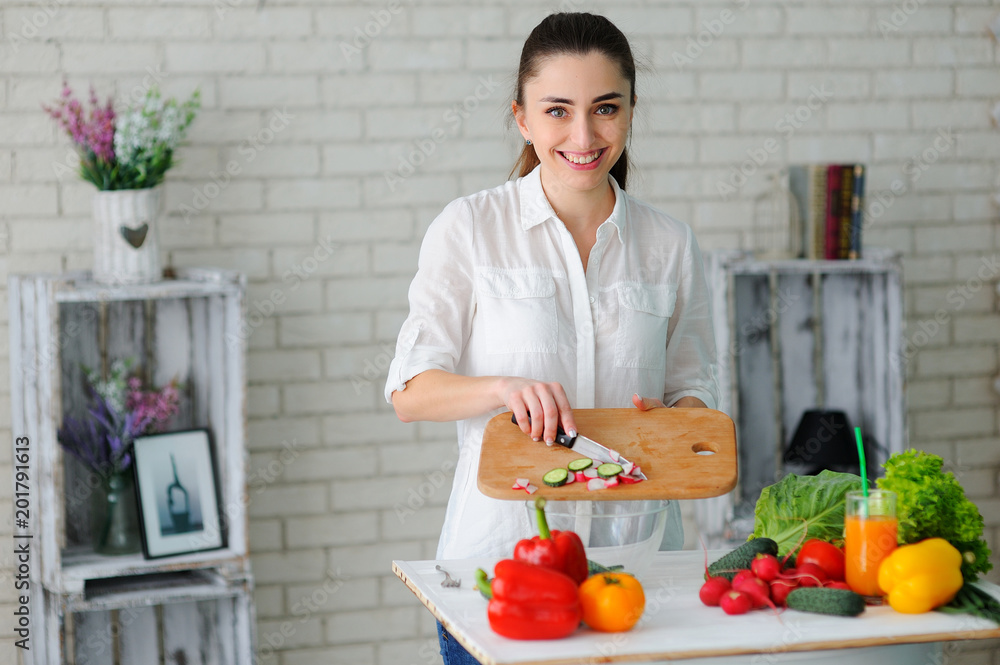 Young Woman Cooking. Healthy Food - Vegetable Salad. Diet. Healthy Lifestyle. Cooking At Home. Prepare Food