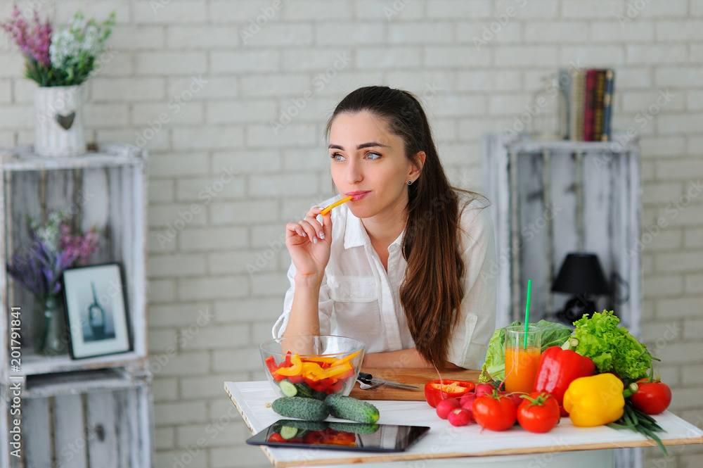 Young Woman Cooking. Healthy Food - Vegetable Salad. Diet. Healthy Lifestyle. Cooking At Home. Prepare Food Young Woman Cooking. Healthy Food - Vegetable Salad. Diet. Healthy Lifestyle. Cooking At Home. Prepare Food