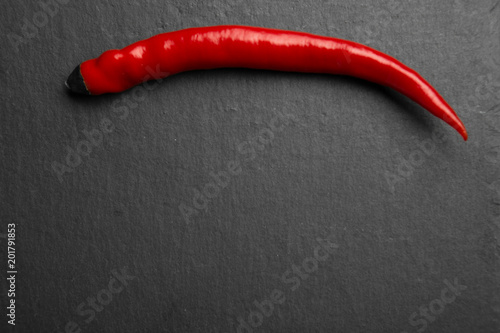 Red chili pepper on slate plate.