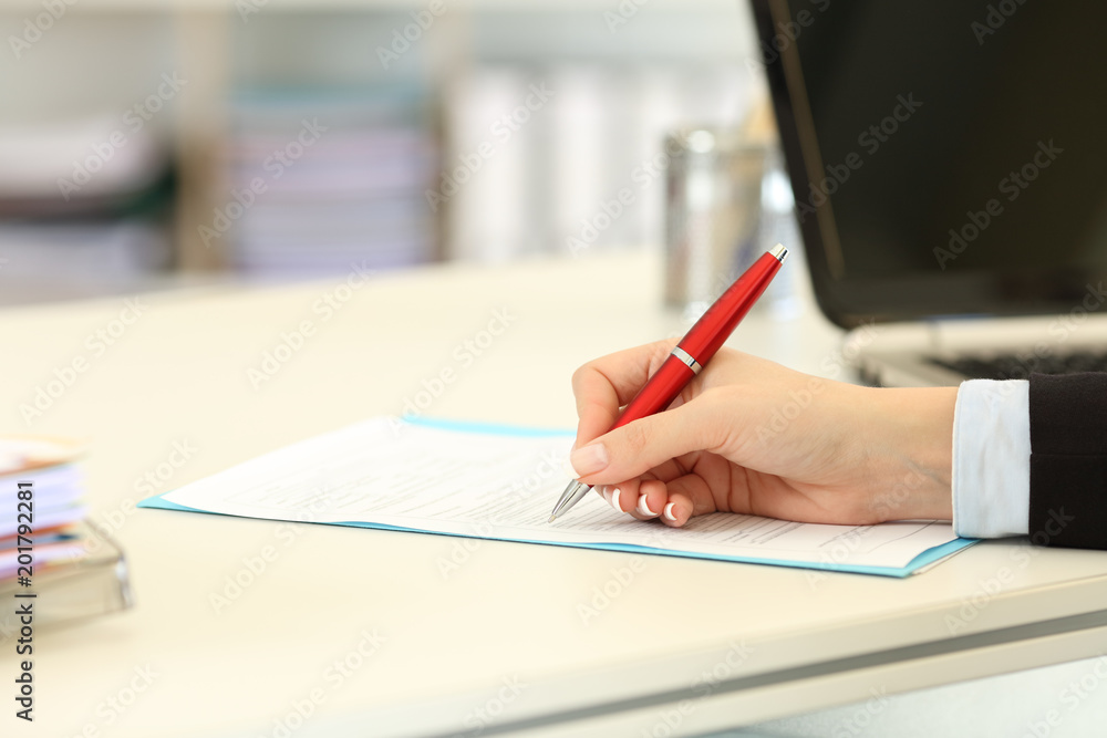 Close up of an executive hand filling form Close up of an executive hand filling form