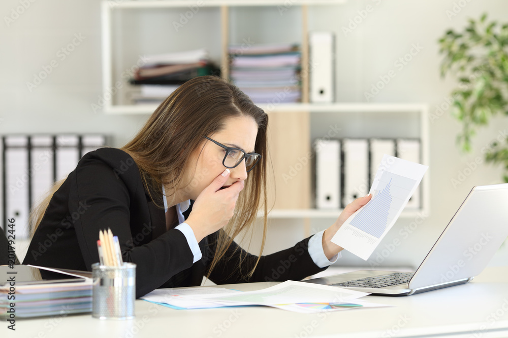 Worried executive checking sales growth graph Worried executive checking sales growth graph