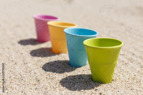 Sand and water toys on the beach.