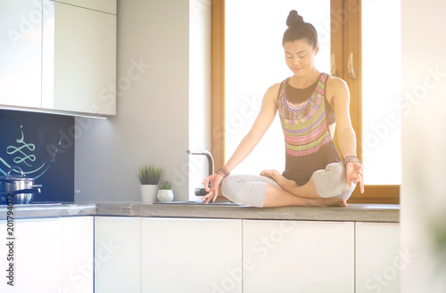 Fit and attractive young woman preparing healthy meal. Woman.