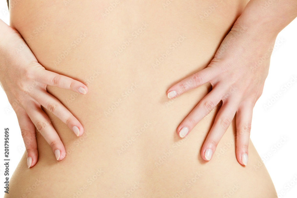 Closeup of woman touching her back