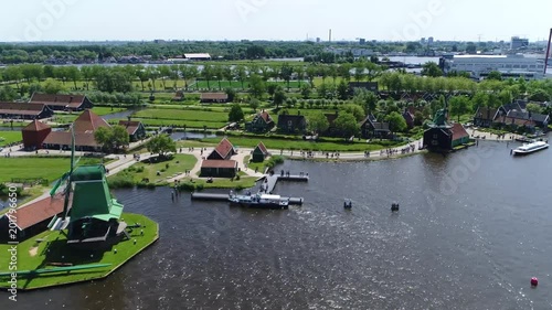 Aerial bird view footage of Zaanse Schans windmills one of the most popular tourist attractions of the Netherlands and an anchor point of ERIH the European Route of Industrial Heritage 4k quality photo