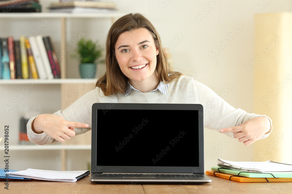 College student showing a blank laptop screen College student showing a blank laptop screen
