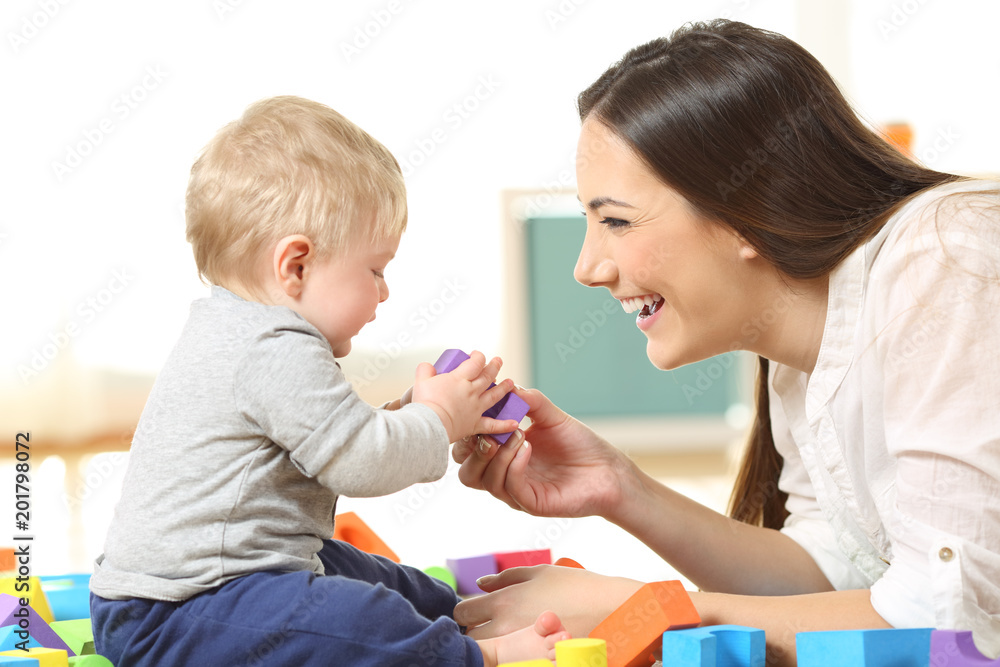 Mother and son playing on the floor Mother and son playing on the floor