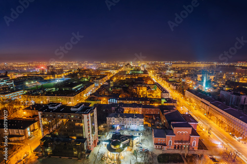 Night Voronezh downtown district. Aerial view from great height of skyscraper roof