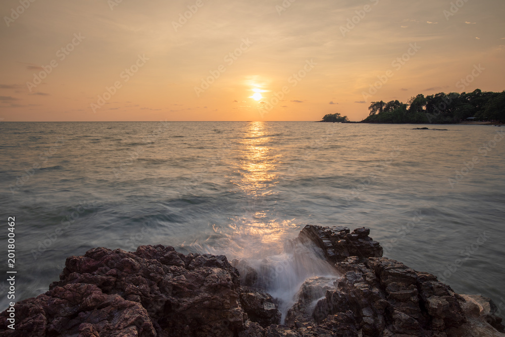 Long Exposures Twilight sunset and sea waves hitting the rocks. Seascape