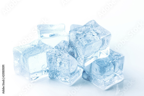 Cubes of clear ice on a white table.
