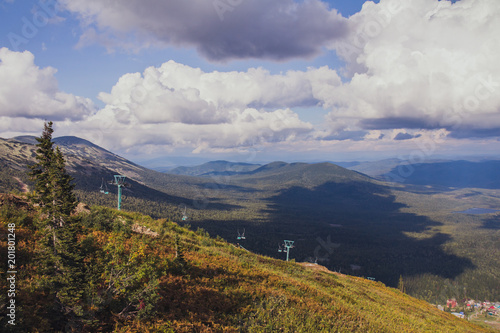 Ski lift mast in a summer mountain landscape at in the Sheregesh, view from tourist eyes photo