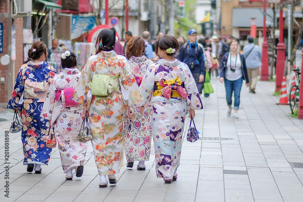 Kimono woman walking at Sensoji or Asakusa Kannon Temple is a Buddhist temple located in Asakusa, landmark and popular for tourist attractions. 7 April 2018, Tokyo, Japan