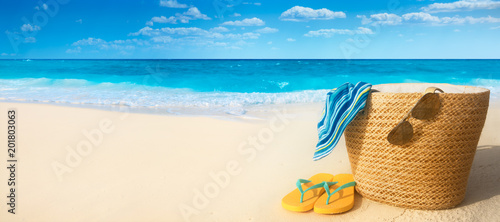 Summer accessories on sandy beach
