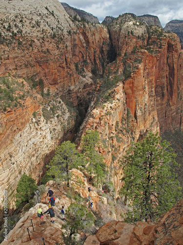 Hikers on double cliff trail to the top of landmark Angeles Landing, Zion National Park, Utah, USA