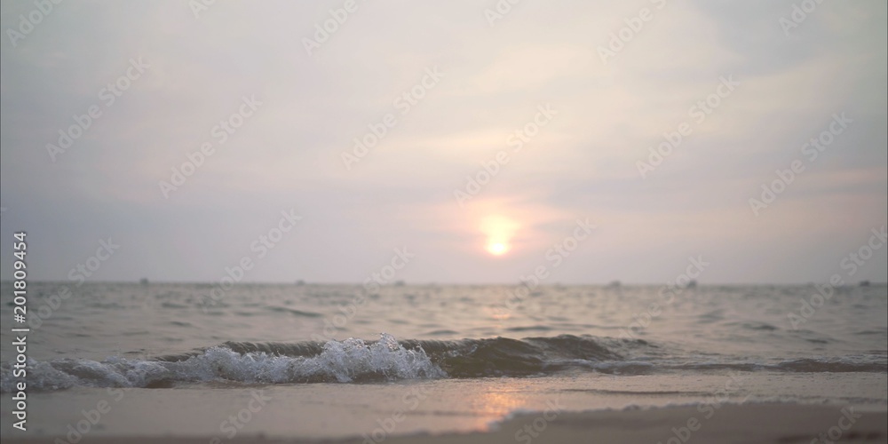  little waves at sunset in the ocean.