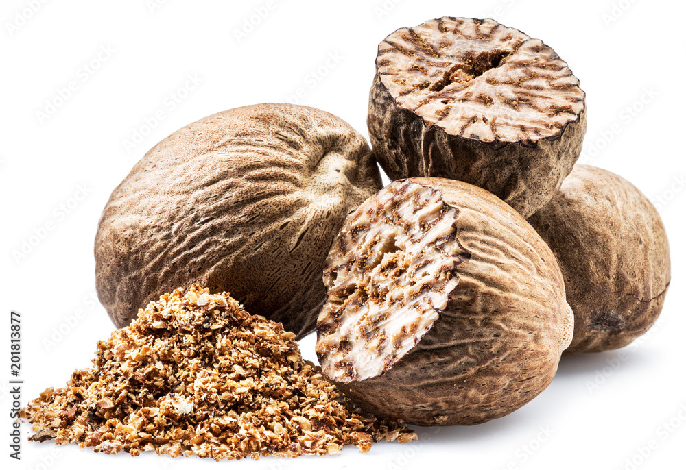 Dried seeds of fragrant nutmeg and grated nutmeg isolated on white background. Dried seeds of fragrant nutmeg and grated nutmeg isolated on white background.