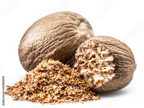 Dried seeds of fragrant nutmeg and grated nutmeg  isolated on white background. photo