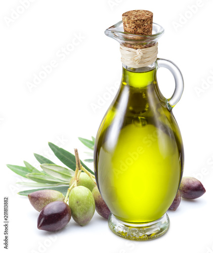Bottle of olive oil and olive berries on white background.