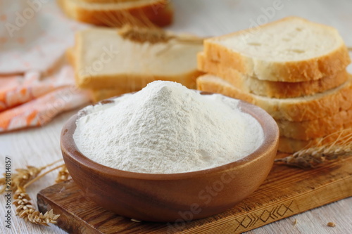 Flour in bowl with grain ears
