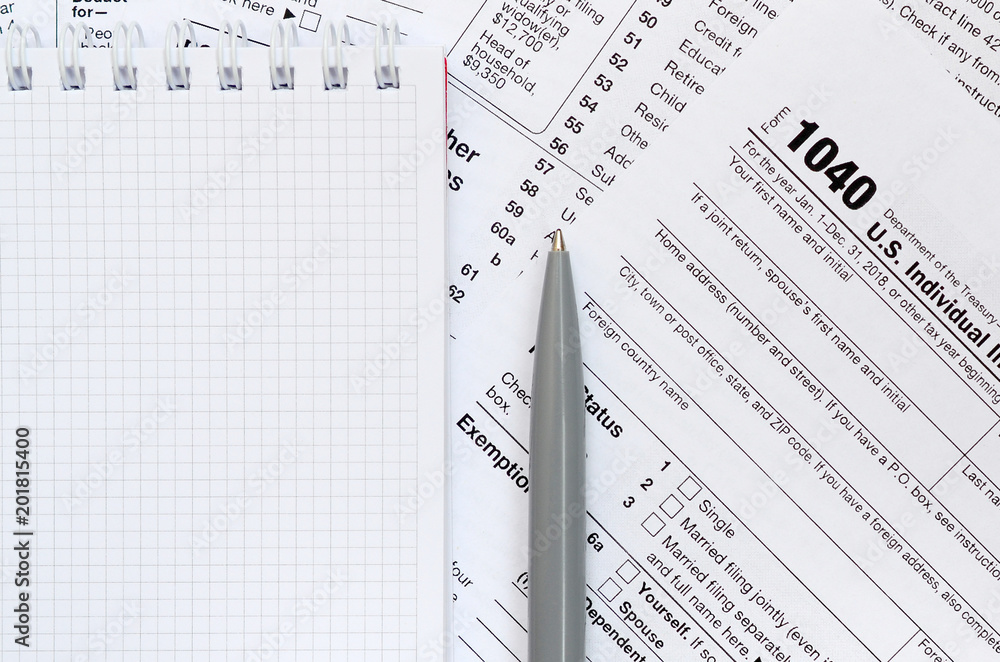 The Pen And Notebook Is Lies On The Tax Form 1040 U S Individual the-pen-and-notebook-is-lies-on-the-tax-form-1040-u-s-individual
