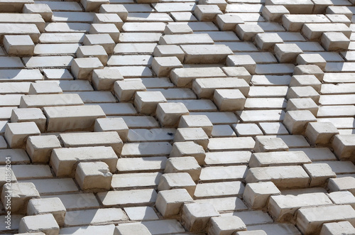 A pattern made of white bricks in the form of diamond shapes. Decoration of the walls during the Soviet Union photo