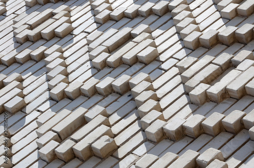 A pattern made of white bricks in the form of diamond shapes. Decoration of the walls during the Soviet Union photo