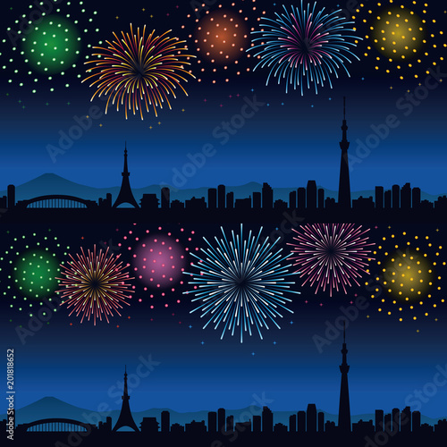 夜の花火と東京の街並み　夏のイメージ