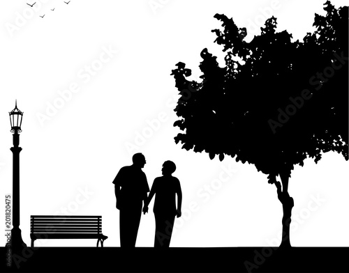 Lovely retired elderly couple walking in the park, one in the series of similar images silhouette