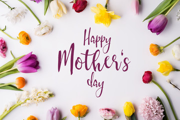 Happy mothers day composition. Flowers on white background. Studio shot.