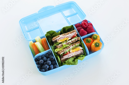 Blue luchbox wiht healty meal top view