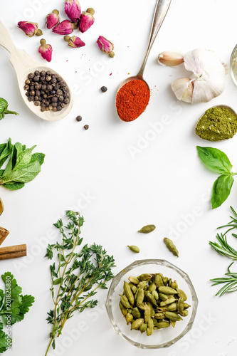 Wallpaper Mural Fresh herbs and dried colorful spices in spoons and bowls arranged in frame on white background with copy space inside Torontodigital.ca