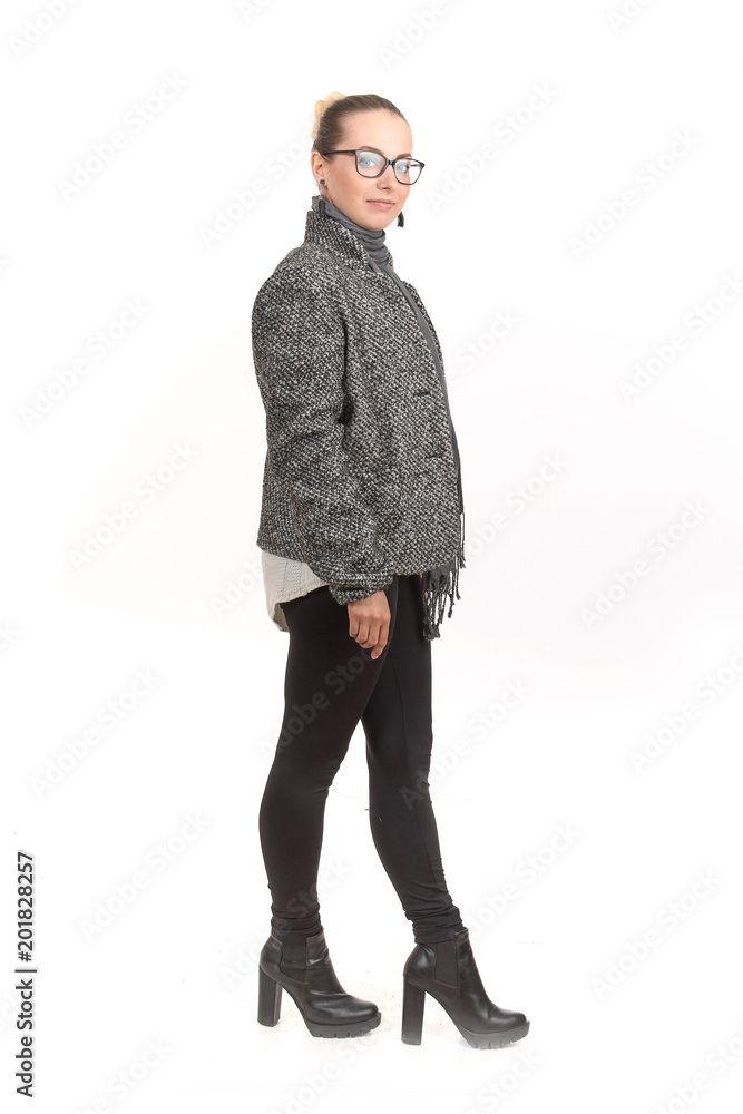 A girl in demi-season clothes with a full-length on a white background. A girl in demi-season clothes with a full-length on a white background.