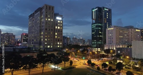 4k aerial footage of Singapore skyscrapers with city skyline during cloudy evening photo