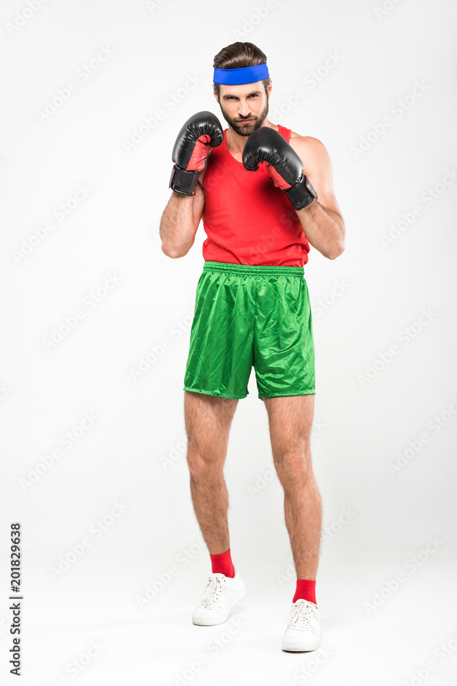 man in retro sportswear and boxing gloves, isolated on white