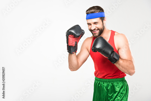 retro man training in boxing gloves, isolated on white