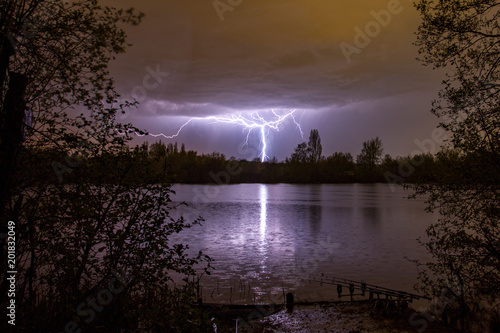 Lightning bolt as summer storm passes over carp fishing lake