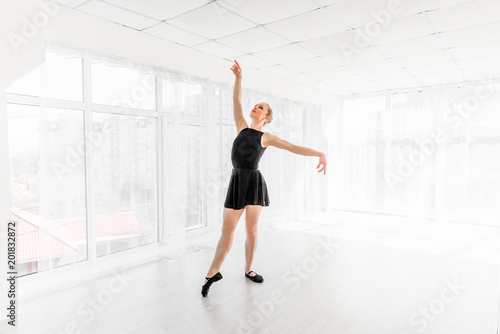 Young ballerina practising ballet moves