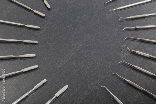 dental instruments on gray background. Top view with copy space for text