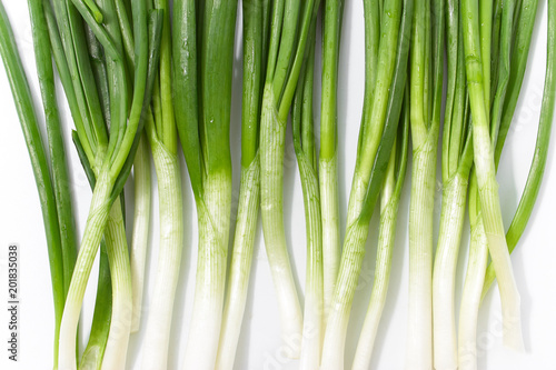 green onion on a white background. spring natural vitamins