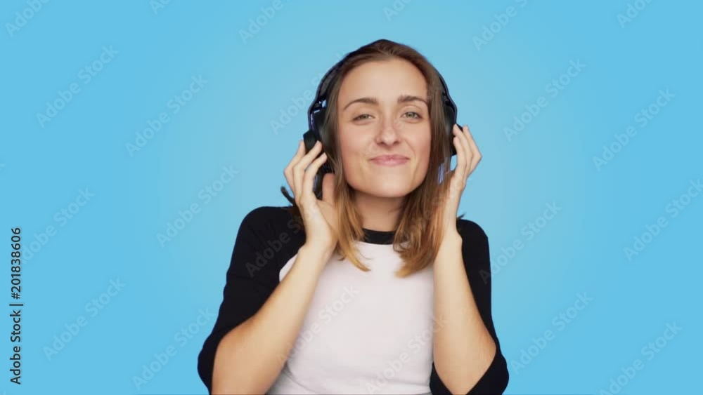 Beautiful,cute and pretty natural attractive young woman, teenager or student listens to favorite track playlist or music song, dances and enjoys, change of tune, disgusted or unsatisfied by bad taste Beautiful,cute and pretty natural attractive young woman, teenager or student listens to favorite track playlist or music song, dances and enjoys, change of tune, disgusted or unsatisfied by bad taste