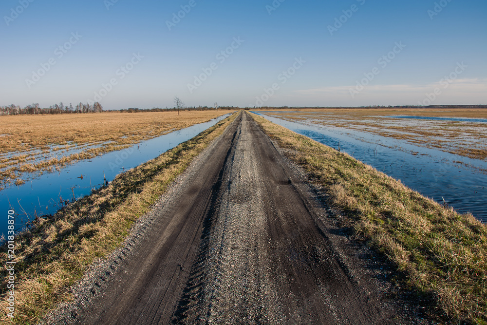 Rural road and flooded meadows