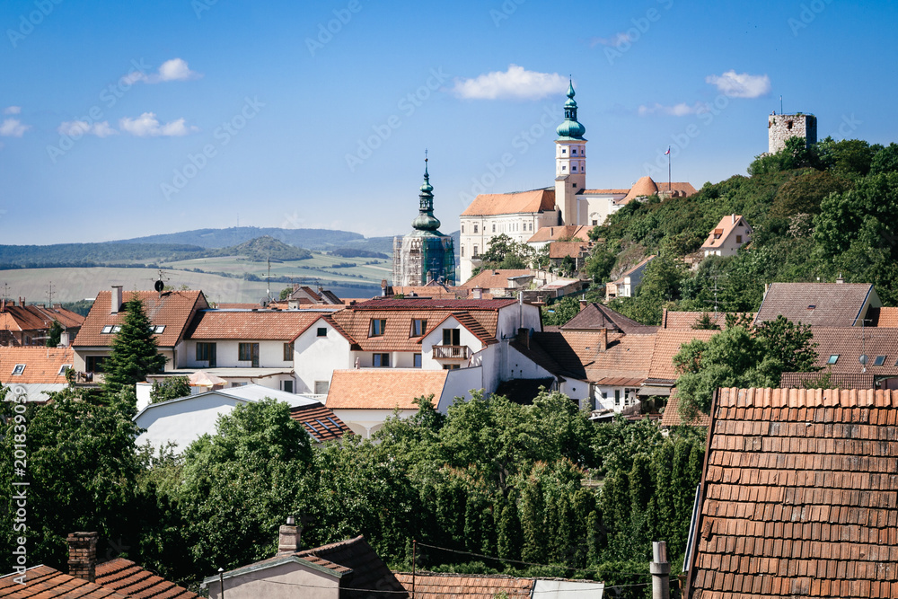 View from Goat Tower (Kozi Hradek) with Mikulov castle (Mikulov Chateau) on top of rock, Panoramic summer view of town of Mikulov, Moravia, Czech Republic