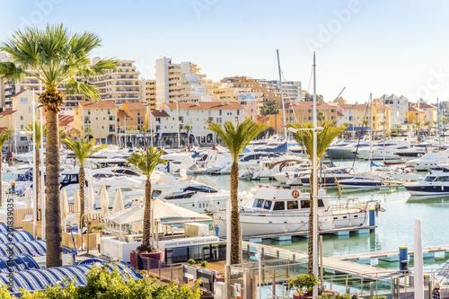 Marina full of luxurious yachts in touristic Vilamoura, Algarve, Portugal