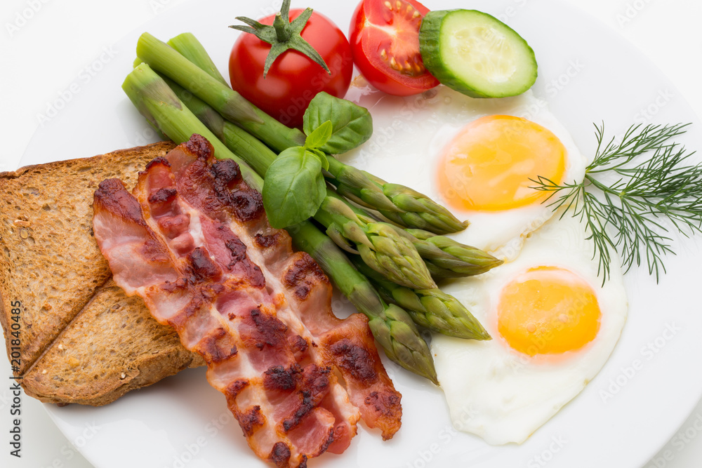 Fried eggs with bacon on the wooden table. Fried eggs with bacon on the wooden table.