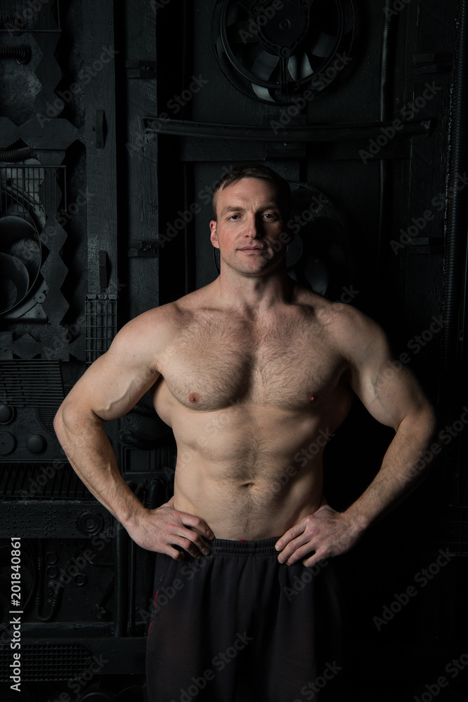 Fototapeta premium Man athlete with six pack and ab. Man with fit torso muscles