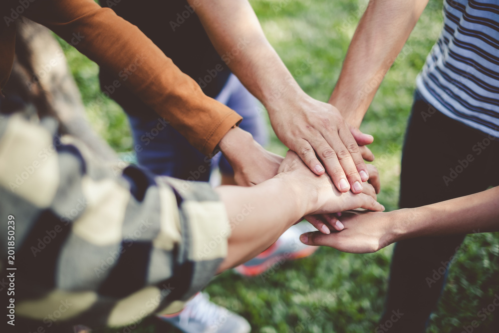 Stacking hands of young teen student, teamwork, togetherness and cooperation concept Stacking hands of young teen student, teamwork, togetherness and cooperation concept
