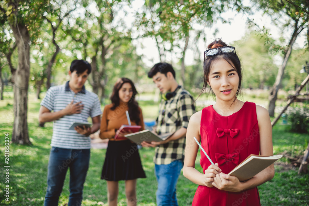 portrait asian young teen student standing in park for studying and education concept portrait asian young teen student standing in park for studying and education concept