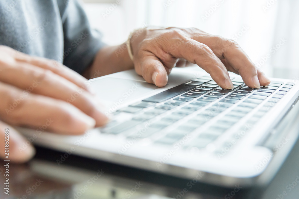 Senior man hand using laptop. Senior man hand using laptop.