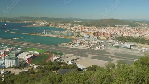 Top view of landing strip of Gibraltar airport and its building